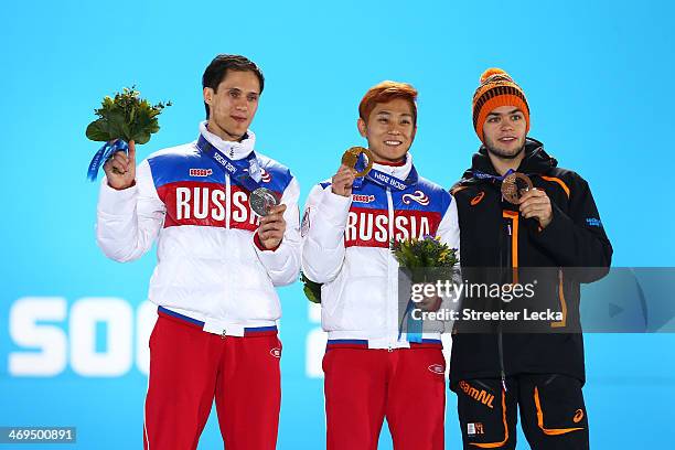 Silver medalist Vladimir Grigorev of Russia, gold medalist Victor An of Russia and bronze medalist Sjinkie Knegt of the Netherlands on the podium...