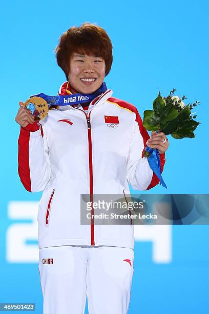 Gold medalist Yang Zhou of China celebrates on the podium during the medal ceremony for the Short Track Speed Skating Women's 1500m on day 8 of the...