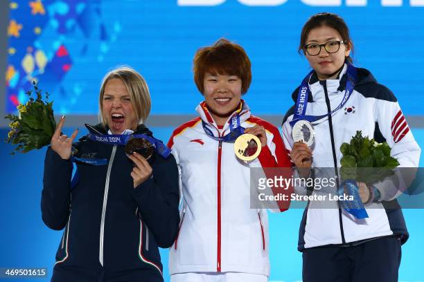 Bronze medalist Arianna Fontana of Italy, gold medalist Yang Zhou of China and Silver medalist Suk Hee Shim of South Korea celebrate during the medal...
