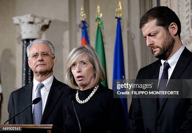 Secretary of the Scelta Civica party Stefania Giannini , flanked by Italain politicians Andrea Romano and Gianluca Susta, speaks to journalists after...