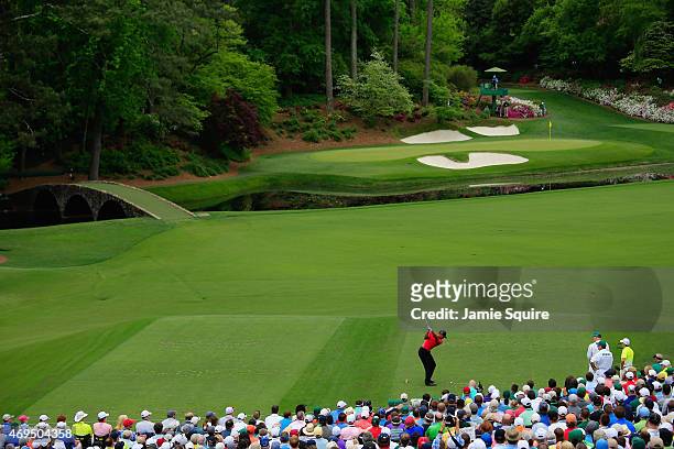 Tiger Woods of the United States hits his tee shot on the 12th hole during the final round of the 2015 Masters Tournament at Augusta National Golf...