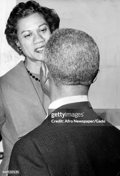 Portrait of Gloria Richardson, leader of the Cambridge movement and civil rights leader, being greeted at Baldwin Hall, Howard University, by one of...