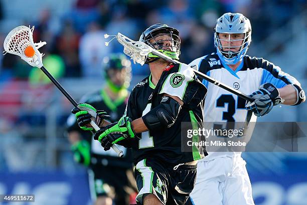 Brian Farrell of the Ohio Machine defends against JoJo Marasco of the New York Lizards at James M. Shuart Stadium on April 12, 2015 in Hempstead, New...