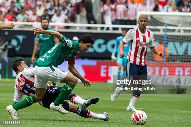 Fabian de la Mora of Chivas fights for the ball with Jonny Magallon of Leon during a match between Chivas and Leon as part of 13th round of Clausura...