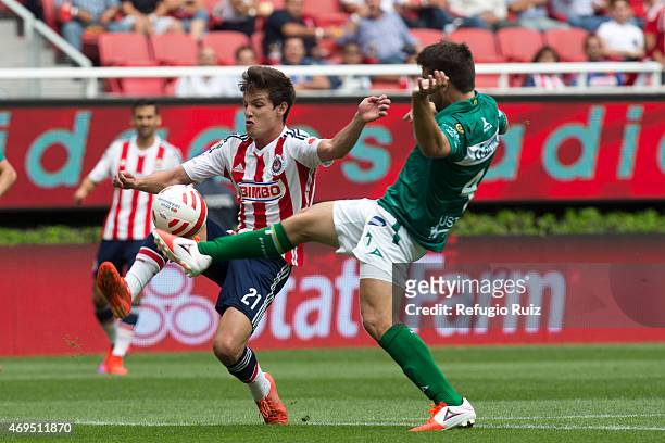 Carlos Fierro of Chivas fights for the ball with Ignacio Canuto of Leon during a match between Chivas and Leon as part of 13th round of Clausura 2015...