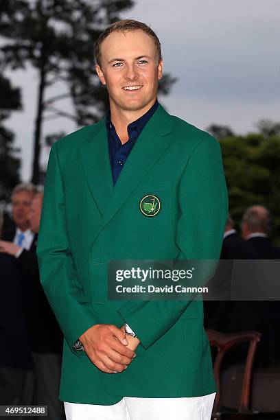 Jordan Spieth of the United States poses with the green jacket after winning the 2015 Masters Tournament at Augusta National Golf Club on April 12,...