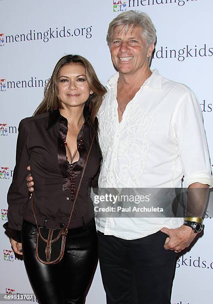 Actress Nia Peeples and her Husband Pro-Surfer Sam George attend the Mending Kids International's "Rock & Roll All-Stars" fundraising event on...