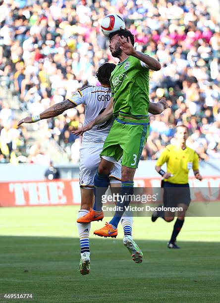 Brad Evans of Seattle Sounders wins a high ball against Alan Gordon of the Los Angeles `Galaxy in the first half of the MLS match at StubHub Center...