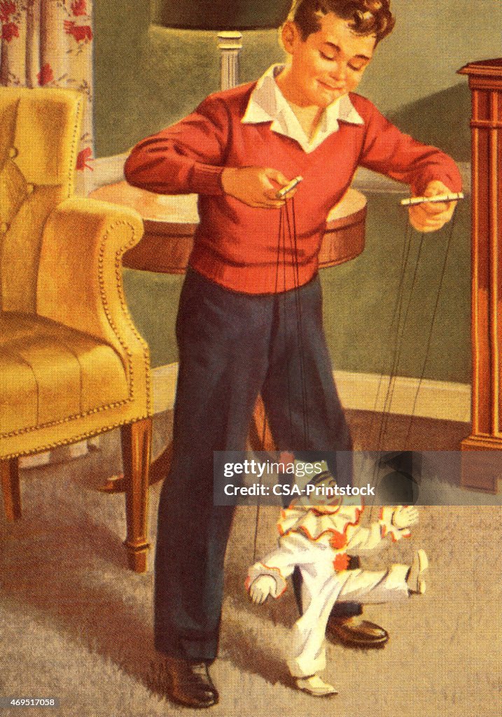 Boy Playing with a Marionette