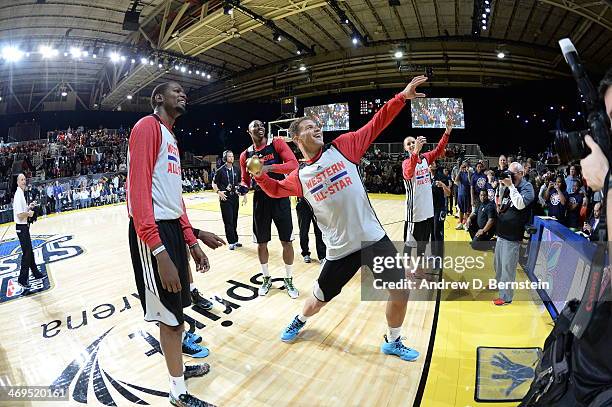 Blake Griffin of the Western Conference All-Stars throws a t-shirt to fans during NBA All-Star Practice at Sprint Arena as part of 2014 NBA All-Star...