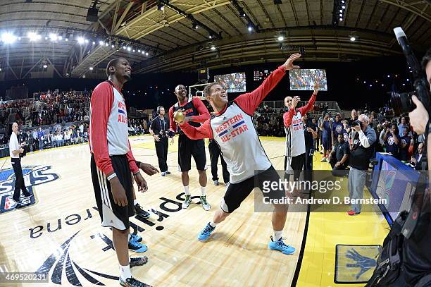 Blake Griffin of the Western Conference All-Stars throws a t-shirt to fans during NBA All-Star Practice at Sprint Arena as part of 2014 NBA All-Star...