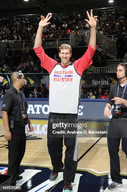 Dirk Nowitzki of the Western Conference All-Stars waves to the crowd during NBA All-Star Practice at Sprint Arena as part of 2014 NBA All-Star...