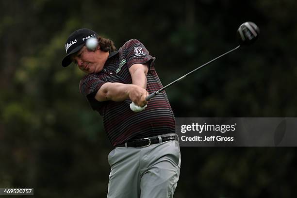 Jason Dufer hits a tee shot on the 12th hole in the third round of the Northern Trust Open at the Riviera Country Club on February 15, 2014 in...