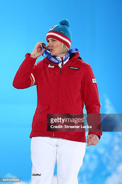 Bronze medalist Nicole Hosp of Austria celebrates on the podium during the medal ceremony for the Alpine Skiing Ladies' Super-G on day 8 of the Sochi...