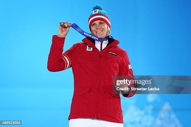 Bronze medalist Nicole Hosp of Austria celebrates on the podium during the medal ceremony for the Alpine Skiing Ladies' Super-G on day 8 of the Sochi...