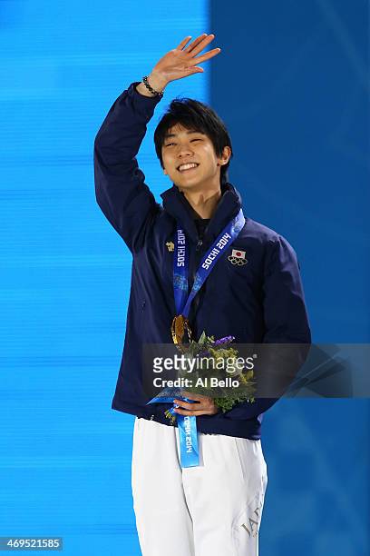 Gold medalist Yuzuru Hanyu of Japan celebrates during the medal ceremony for the Men's Figure Skating on day 8 of the Sochi 2014 Winter Olympics at...