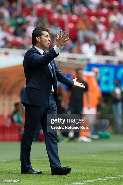 Manuel de la Torre coach of Chivas gives instructions to his players during a match between Chivas and Leon as part of 13th round of Clausura 2015...