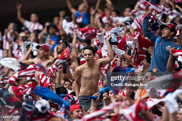 Fans of Chivas cheer for their team during a match between Chivas and Leon as part of 13th round of Clausura 2015 Liga MX at Omnilife Stadium on...