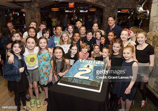 The cast of Matilda pose at the "Matilda" On Broadway Second Anniversary Celebration at Bowlmor Lanes Times Square on April 12, 2015 in New York City.