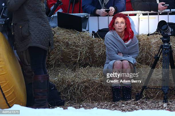 Holly Garshong from the United Kingdom takes a break after finishing her run in the 2014 Naken Sledding World Championships on February 15, 2014 in...