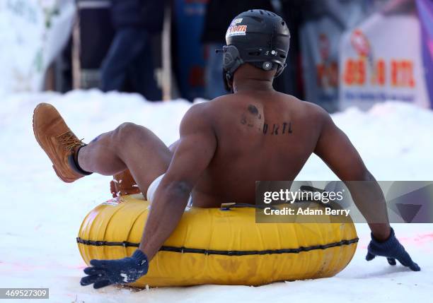 Male participant finishes his run in the 2014 Naken Sledding World Championships on February 15, 2014 in Hecklingen, near Magdeburg, Germany. The...