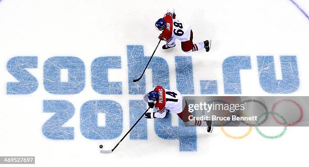 Tomas Plekanec and Jaromir Jagr of the Czech Republic skate down ice against Switzerland during the Men's Ice Hockey Preliminary Round Group C game...