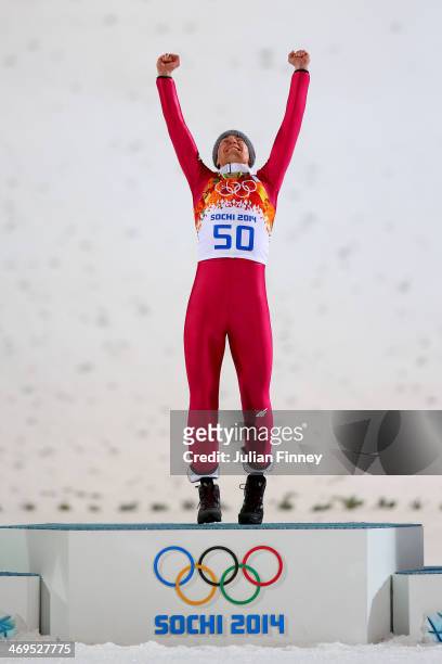Gold medalist Kamil Stoch of Poland celebrates on the podium during the flower ceremony after the Men's Large Hill Individual Final Round on day 8 of...