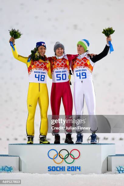 Silver medalist Noriaki Kasai of Japan, gold medalist Kamil Stoch of Poland and bronze medalist Peter Prevc of Slovenia celebrate on the podium...