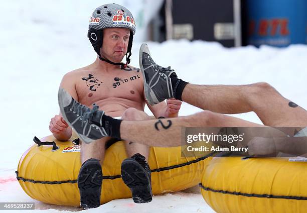 Male participants compete in the 2014 Naken Sledding World Championships on February 15, 2014 in Hecklingen, near Magdeburg, Germany. The annual...