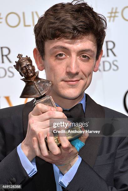 John Dagleish poses in the winners room at The Olivier Awards at The Royal Opera House on April 12, 2015 in London, England.