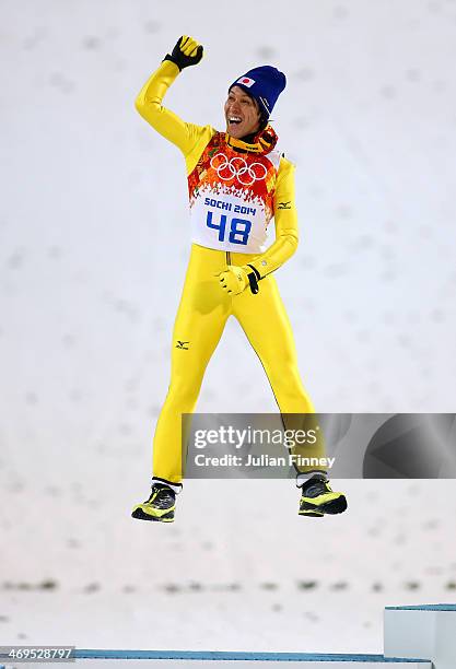 Silver medalist Noriaki Kasai of Japan celebrates on the podium during the flower ceremony after the Men's Large Hill Individual Final Round on day 8...