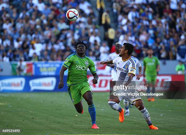 Obafemi Martins of Seattle Sounders FC and A.J. DeLaGarza of Los Angeles Galaxy vie for the ball in the second half of the MLS match at StubHub...