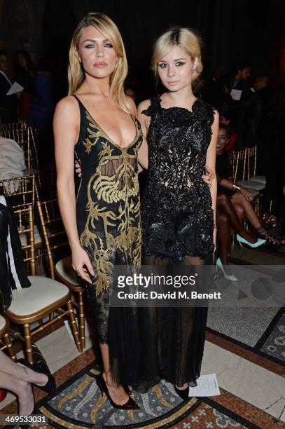 Abbey Clancy and Nina Nesbitt attend the Julien Macdonald show at London Fashion Week AW14 at the Royal Courts of Justice, Strand on February 15,...