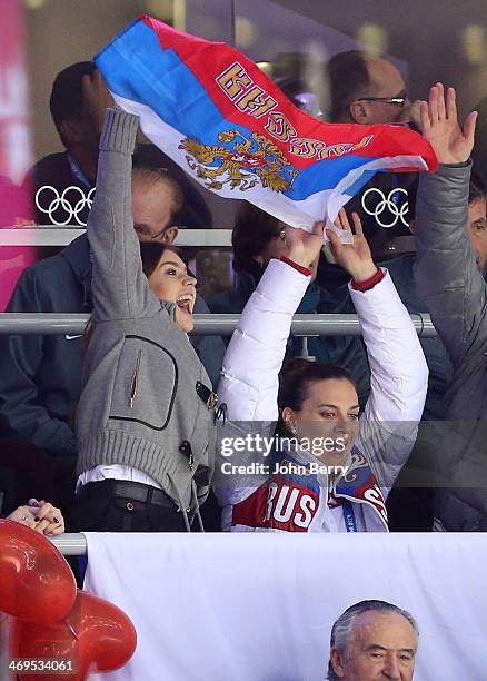 Former rhythmic gymnast Alina Kabayeva and pole vaulter Yelena Isinbayeva of Russia attend the Men's Ice Hockey Preliminary Round Group A game...