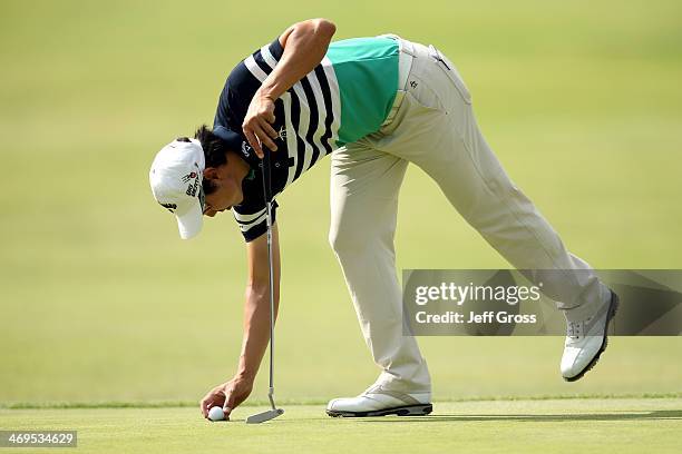 Sang-Moon Bae of Korea puts his ball down on the green in the third round of the Northern Trust Open at the Riviera Country Club on February 15, 2014...