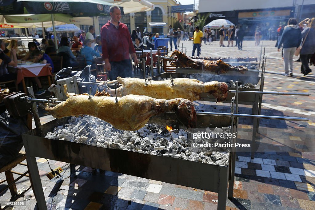 Lambs are barbecued on a spit in Monastiraki Square in...