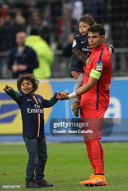 Thiago Silva of PSG and his sons Iago Da Silva and Isago Da Silva celebrate the victory after the French League Cup final between Paris Saint-Germain...