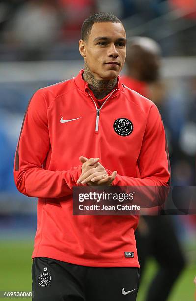 Gregory Van Der Wiel of PSG celebrates the victory after the French League Cup final between Paris Saint-Germain FC and Sporting Club de Bastia at...