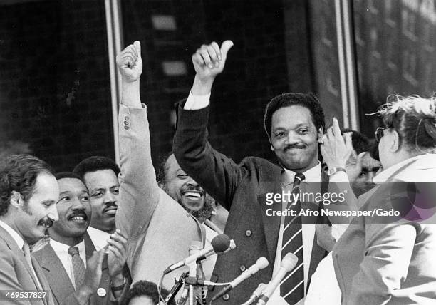 Rev Jesse Jackson, Baptist minister and civil rights leader, acknowledges cheers from the crowds gathered at downtown Hopkins Plaza and gives a...