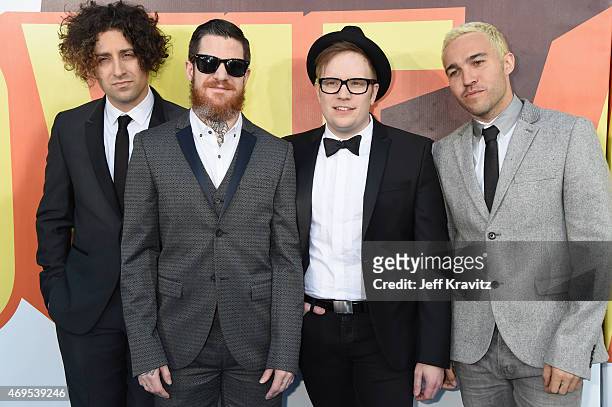 Musicians Joe Trohman, Andy Hurley, Patrick Stump and Pete Wentz of the band Fall Out Boy attend The 2015 MTV Movie Awards at Nokia Theatre L.A. Live...