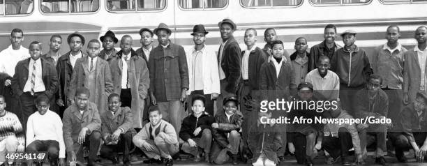 Group photograph of YMCA members who were awarded a trip for their good conduct are shown just before they left for Baltimore to see a professional...