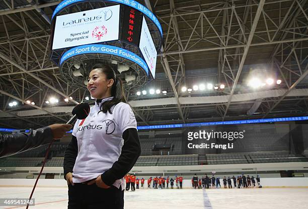 Laureus World Sports Academy member Yang Yang speaks to the media during a visit to a Laureus Sport For Good Project prior to the Laureus World...