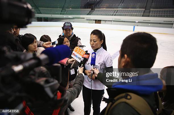 Laureus World Sports Academy member Yang Yang speaks to the media during a visit to a Laureus Sport For Good Project prior to the Laureus World...