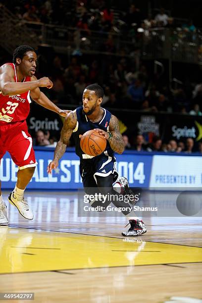 Pierre Jackson of the Futures handles the ball against Melvin Ely of the Prospects during the NBA D-League All-Star Game at Sprint Arena as part of...