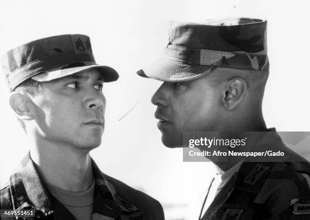 Head and shoulders portrait of actors Denzel Washington and Lou Diamond Phillips, a movie still from 'Courage under Fire' about a US Army officer...