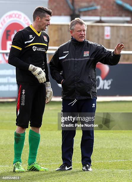 Northampton Town manager Chris Wilder gives instructions to Matt Duke during the pre match warm up prior to the Sky Bet League Two match between...