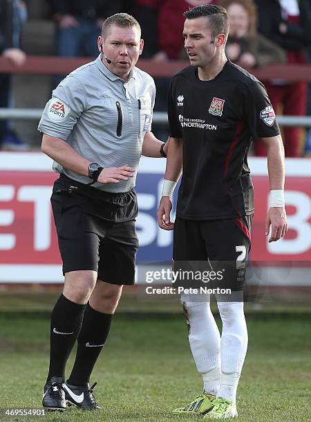 Referee Richard Clark makes a point to Leon McSweeney of Northampton Town during the Sky Bet League Two match between Fleetwood Town and Northampton...