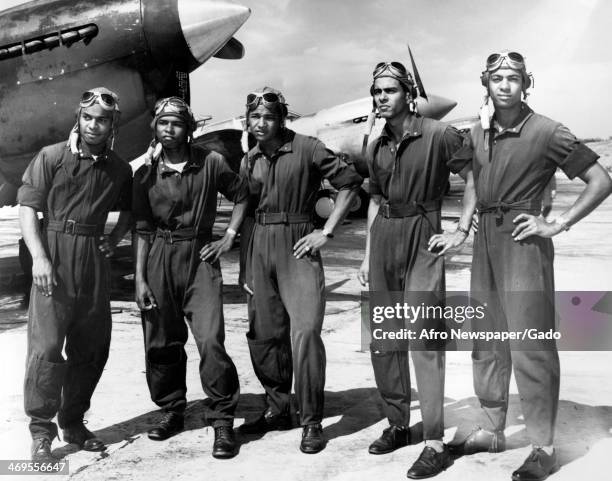 Tuskegee Airmen at Tuskegee Army Flying School, with fighter aircraft, Tuskegee, Alabama, 1942.