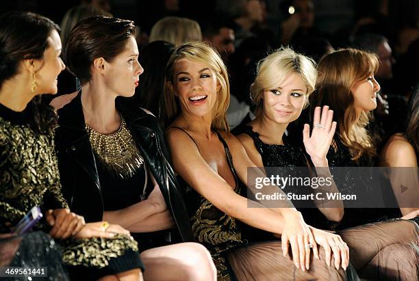 Abbey Clancy, Nina Nesbitt and Milly Mackintosh attend the Julien Macdonald show at London Fashion Week AW14 at Royal Courts of Justice, Strand on...