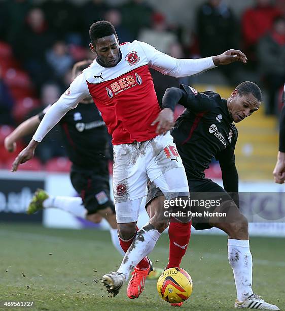 Jamille Matt of Fleetwood Town contests the ball with Mathias Kouo-Doumbe of Northampton Town during the Sky Bet League Two match between Fleetwood...